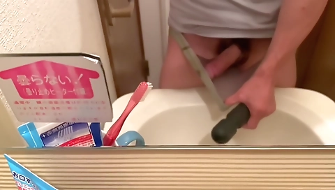 Sexy young chick masturbates with a dildo